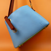 Orange Shield Your Body SYB purse for mobile phones, stylish accessory with secure hanging design, on a neutral background.