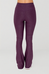 Black leather-look crossover flare leggings by Fitkitty Culture, showcasing their sleek, stylish design and high-waist fit.