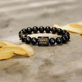 Rainbow Obsidian Protection Bracelet by Conscious Items featuring colorful polished stones on a stretch cord.