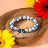 Close-up of Rare K2 Stone bracelet by Conscious Items, showcasing the unique blue and gray natural stone beads for spiritual adventure.