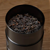 August Uncommon Tea All The Rare Leaves luxury single origin tea gift set bundle with black pearl tea leaves, open package showing tea bags