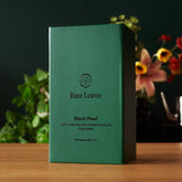 Single estate Taiwanese dark roasted oolong tea leaves in a package, from Rare Leaves Black Pearl by August Uncommon Tea.