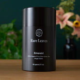 Front of tin containing Rare Leaves Emerald Pi Lo Chun green tea by August Uncommon Tea, showcasing the tea packaging.