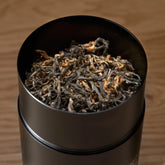 Single estate Nepalese black tea from Rare Leaves Gold by August Uncommon Tea, featuring dark, golden leaf accents in a close-up shot.