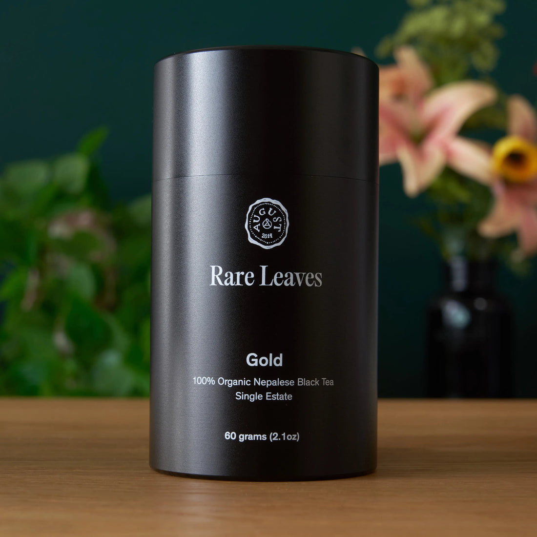 Front view of Rare Leaves Gold Nepalese Black Tea tin from August Uncommon Tea, showcasing the elegant gold label and packaging.