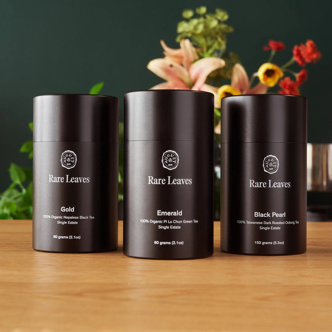 Luxury single origin tea gift set by August Uncommon Tea featuring rare leaves in an elegant bundle.