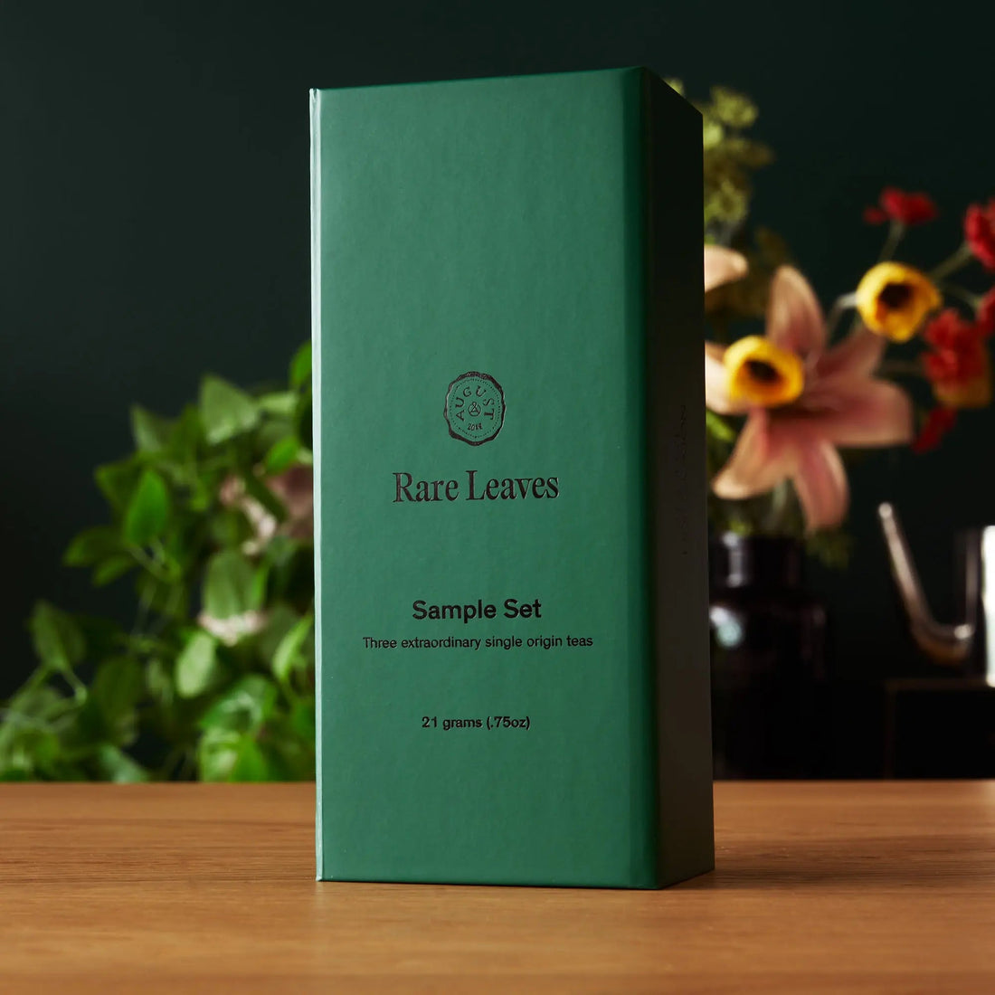 Assorted rare leaves tea sampler set in a compact box, featuring miniature tins of single origin teas by August Uncommon Tea.