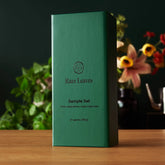 Assorted rare leaves tea sampler set in a compact box, featuring miniature tins of single origin teas by August Uncommon Tea.