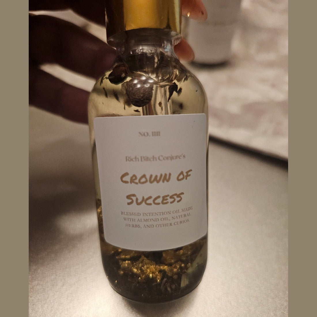 Rich Bitch Conjure Crown of Success Hoodoo Oil in a small glass bottle, used for achievement, recognition, and success rituals.