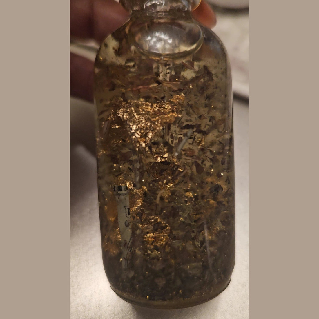 Rich Bitch Conjure Crown of Success Hoodoo Oil in a small glass bottle, featuring a label for achievement and career success rituals.