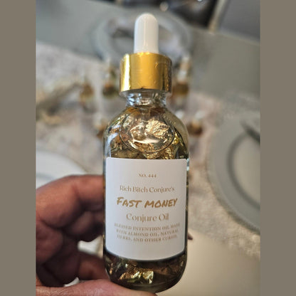 Rich Bitch Conjure Fast Money Oil bottle, luxury hoodoo conjure oil for quick cash and prosperity, with detailed label and vibrant packaging.