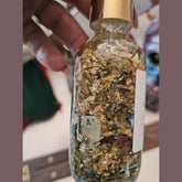 Rich Bitch Conjure Fast Money Oil bottle, luxury hoodoo conjure oil for attracting quick cash and prosperity.