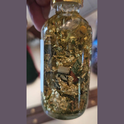 Rich Bitch Conjure Fast Money Oil in a small glass bottle with a black cap, used for attracting quick cash and prosperity.