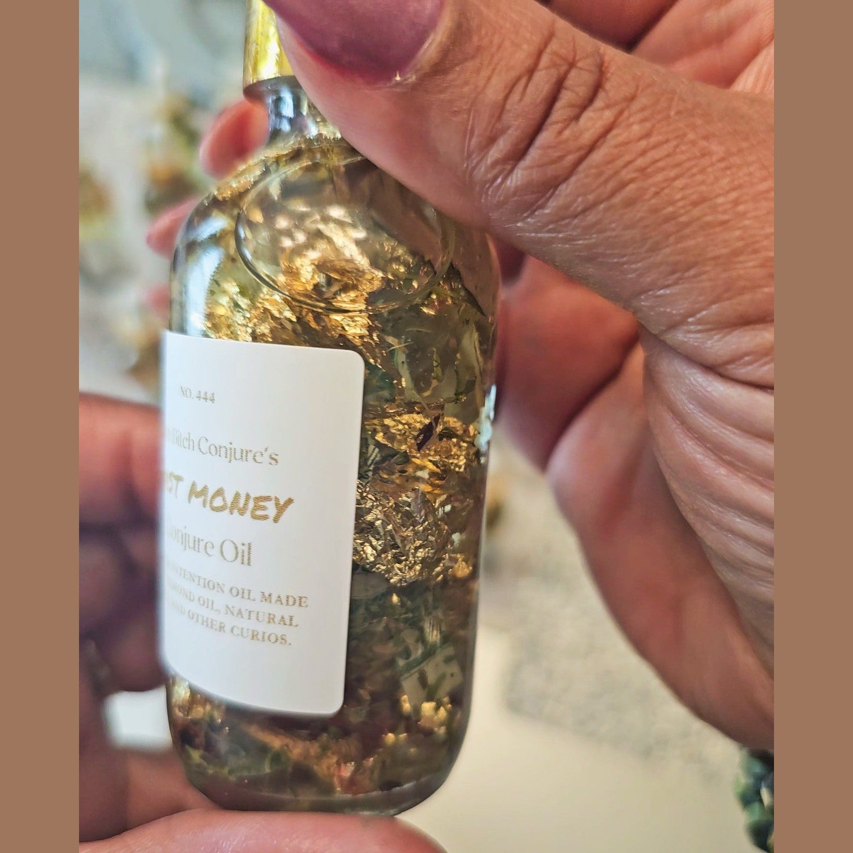 Rich Bitch Conjure Fast Money Oil in a small glass bottle, designed for prosperity and quick cash in hoodoo practices.