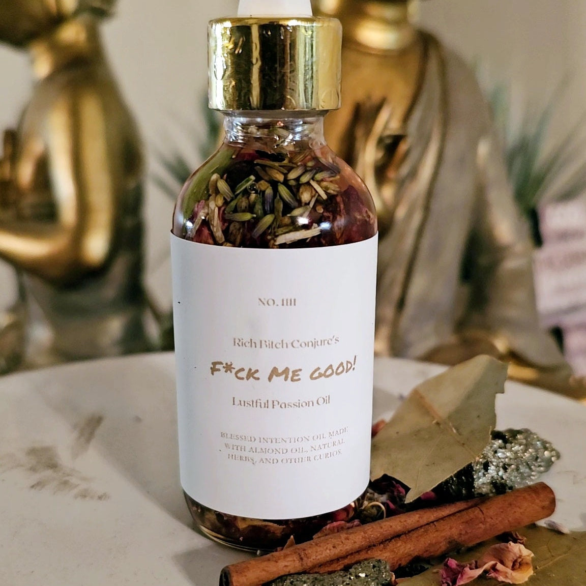 Rich Bitch Conjure FMG Hoodoo Conjure Oil for lust, passion, and attraction, shown in a amber glass bottle with spiritual symbols.