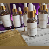 Rich Bitch Conjure Marry Me Hoodoo Oil in a small glass bottle, used for love and marriage rituals in spiritual rootwork practices.
