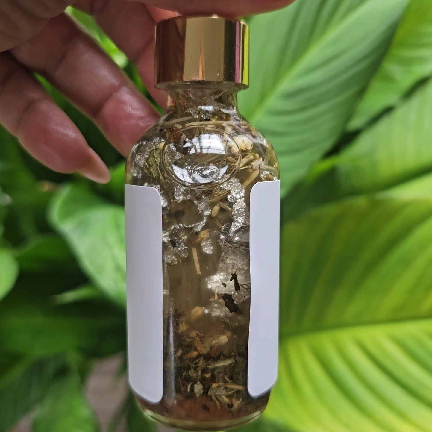 Rich Bitch Conjure Hoodoo Protection Oil bottle with label, featuring a dark glass container and mystical design elements.