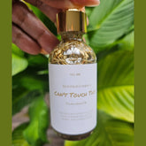 Rich Bitch Conjure Hoodoo Protection Oil bottle with ornate label and dark liquid inside, used for spiritual protection rituals.
