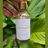 Rich Bitch Conjure Hoodoo Protection Oil in a small glass bottle with a black cap, labeled with mystical symbols and branding.