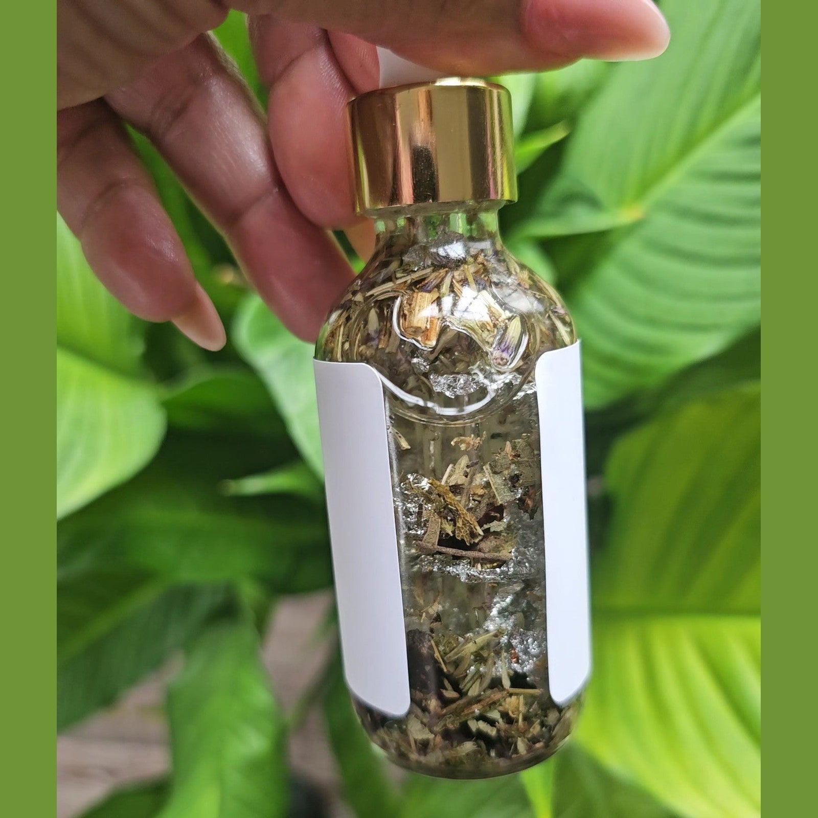Rich Bitch Conjure Hoodoo Cleansing Oil with angelica, natural herbal blend for spiritual cleansing and protection.