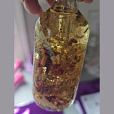 Rich Bitch Conjure Hoodoo Money Oil bottle with label, dark glass container, and gold accents, used for attracting financial luck.