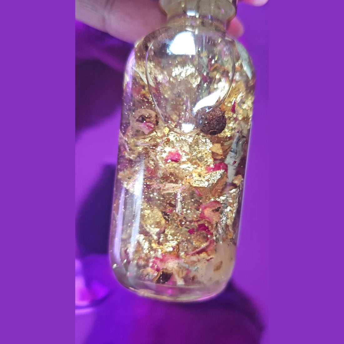 Rich Bitch Conjure Fast Luck Money Oil in a small glass bottle with a dropper, used for hoodoo and spiritual practices.