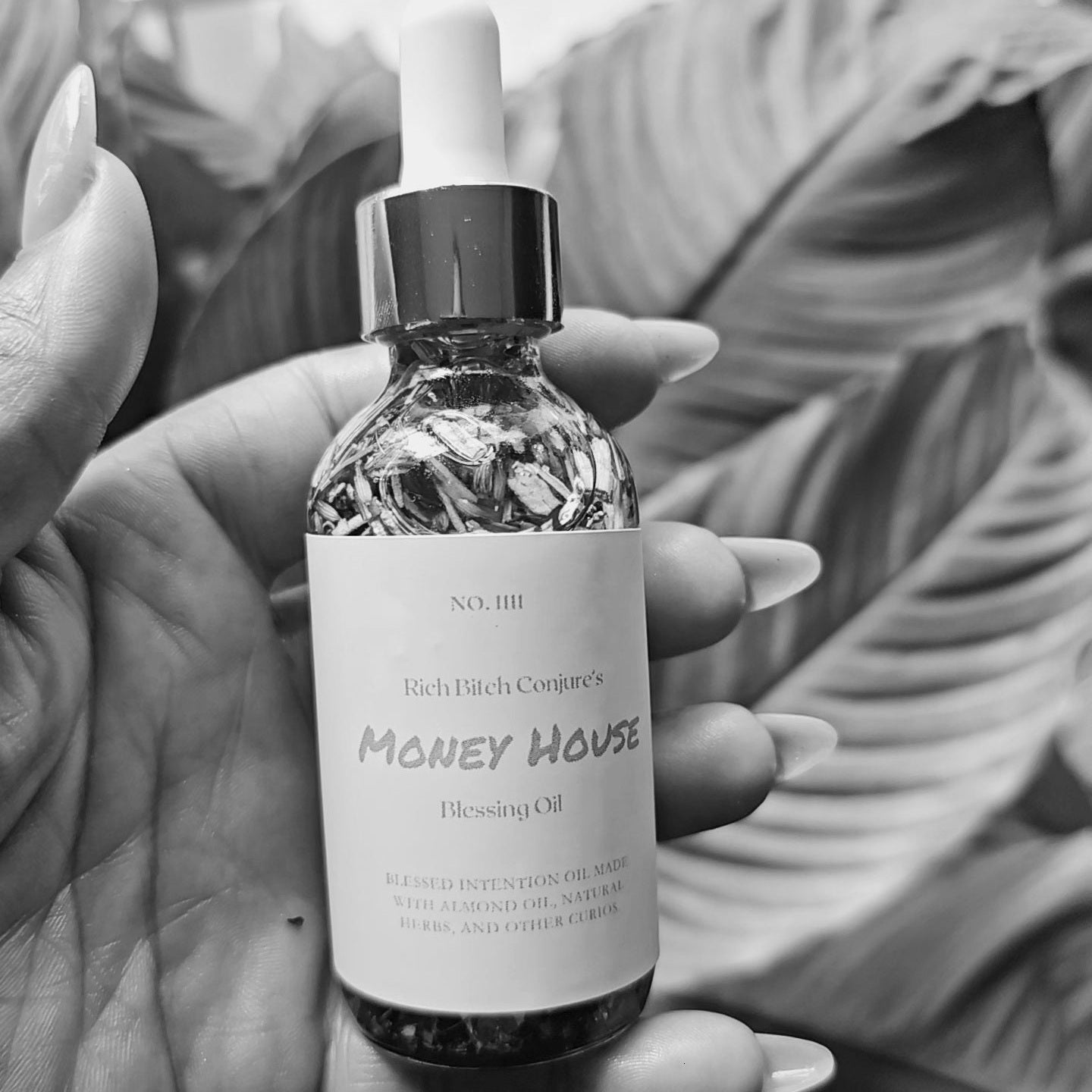Rich Bitch Conjure Hoodoo Oil, Money House Blessing Oil bottle with label, used for prosperity and financial success.