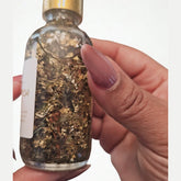 Rich Bitch Conjure Hoodoo Oil bottle with label, featuring rich, dark-colored oil for money attraction and prosperity rituals.