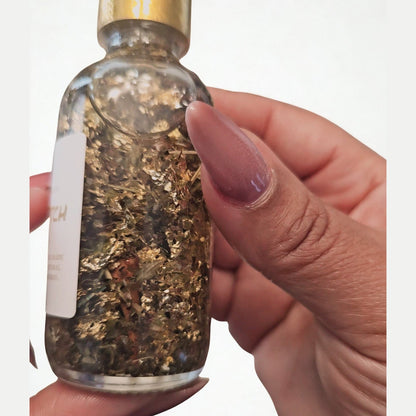 Rich Bitch Conjure Hoodoo Oil bottle with label, featuring rich, dark-colored oil for money attraction and prosperity rituals.