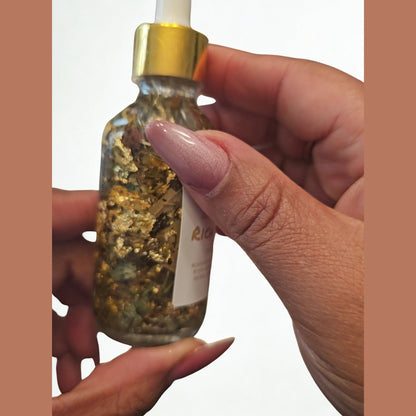 Rich Bitch Conjure Hoodoo Oil for money attraction and prosperity, featuring a small glass bottle with a gold cap and labeled packaging.
