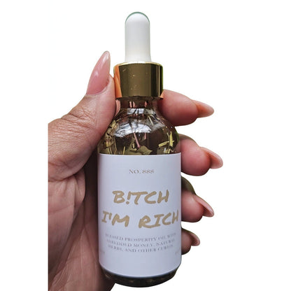 Rich Bitch Conjure Hoodoo Oil for money attraction, wealth, and prosperity rituals, featuring a small glass bottle with oil and herbal ingredients.
