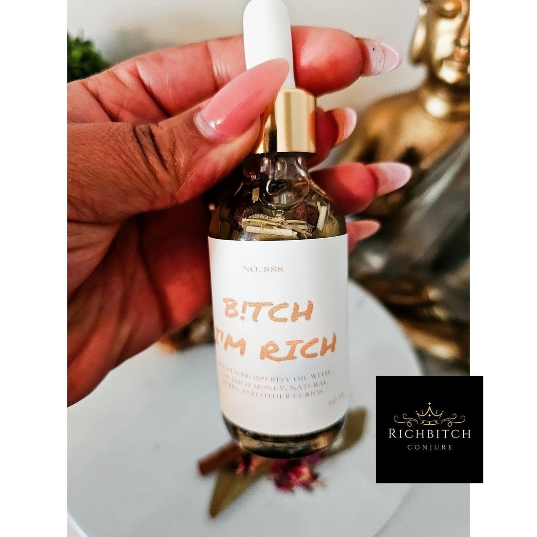 Rich Bitch Conjure Hoodoo Oil bottle labeled Rich Bitch Money Drawing Oil for wealth and prosperity rituals.