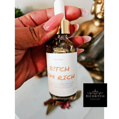 Rich Bitch Conjure Hoodoo Oil bottle labeled Rich Bitch Money Drawing Oil for wealth and prosperity rituals.