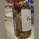 Rich Bitch Conjure Raven Hoodoo Oil for intuition, manifestation, and spiritual power, displayed in a small glass bottle with a black cap.