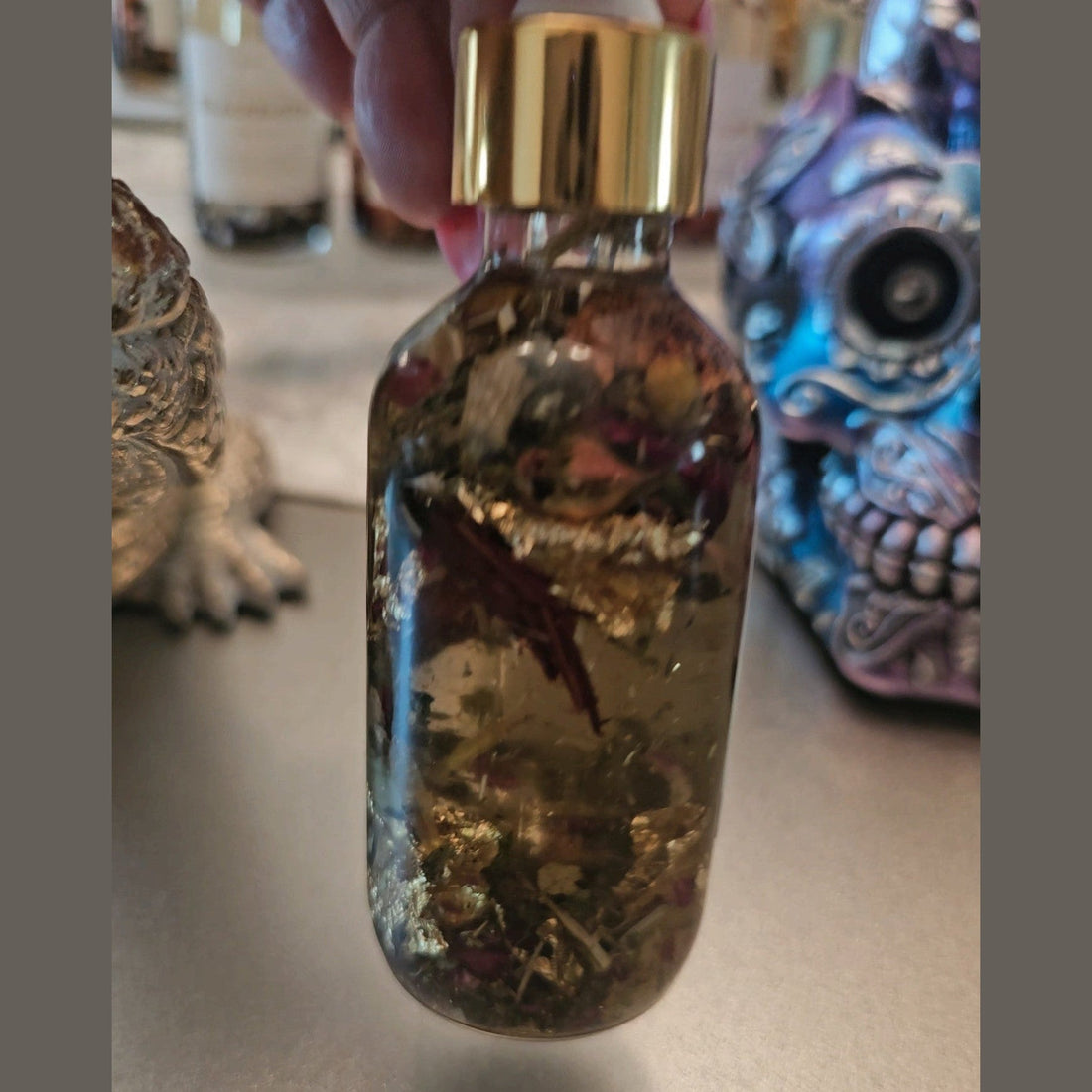 Rich Bitch Conjure Hoodoo Oil for intuition, manifestation, and spiritual power, in a small glass bottle with a dropper.