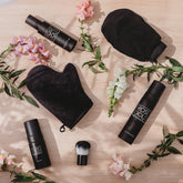 Rose Gold Sunless Face & Body Self Tanning Bundle showing tanning lotions and accessories in a complete glow collection.