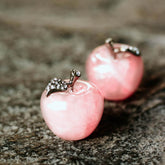 Pair of rose quartz love apples for home decoration, crafted by Conscious Items, featuring smooth pink stone with polished finish.