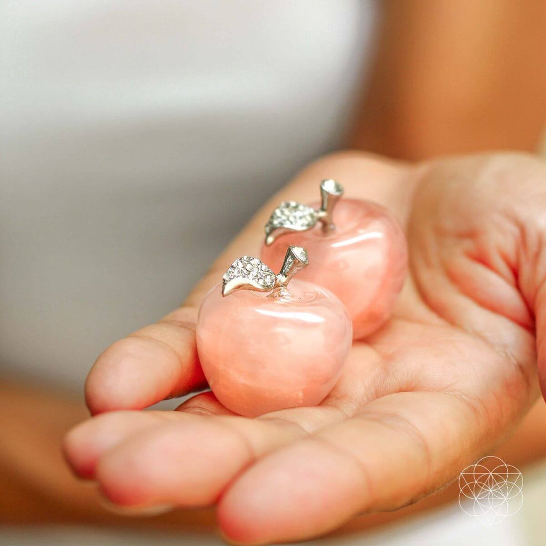 Beautiful rose quartz love apples used as home decoration, showcasing smooth pink stone with natural variations.