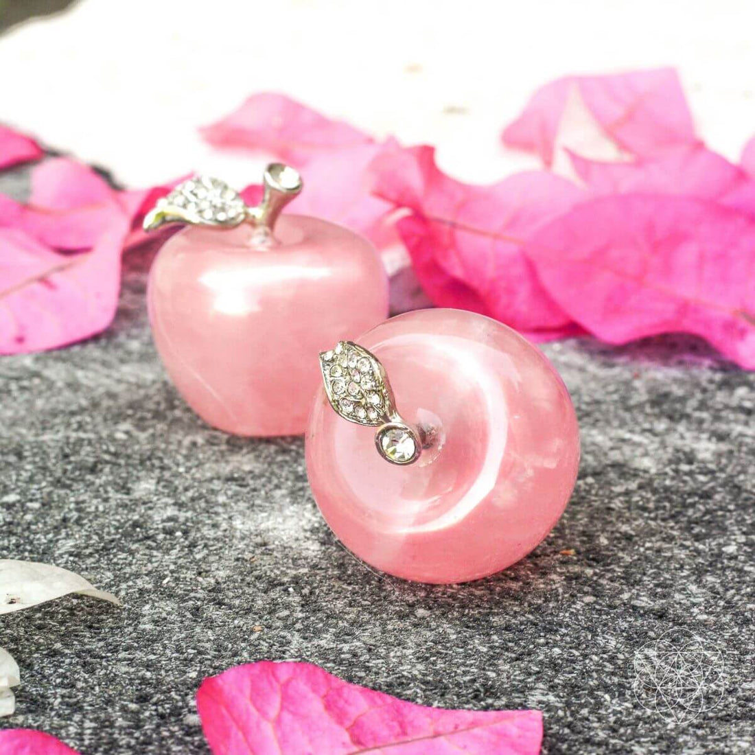 Two polished rose quartz love apples used as elegant home decoration by Conscious Items.