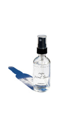 Organic Pure Rose Facial Toner by Pretty Farm Girl in a 2oz bottle, featuring a clear liquid with rose petals visible inside.