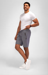 Gray SCR Sportswear Urban Stride All-Day Wear Shorts with 11-inch inseam and zippered pockets, suitable for travel and casual wear.