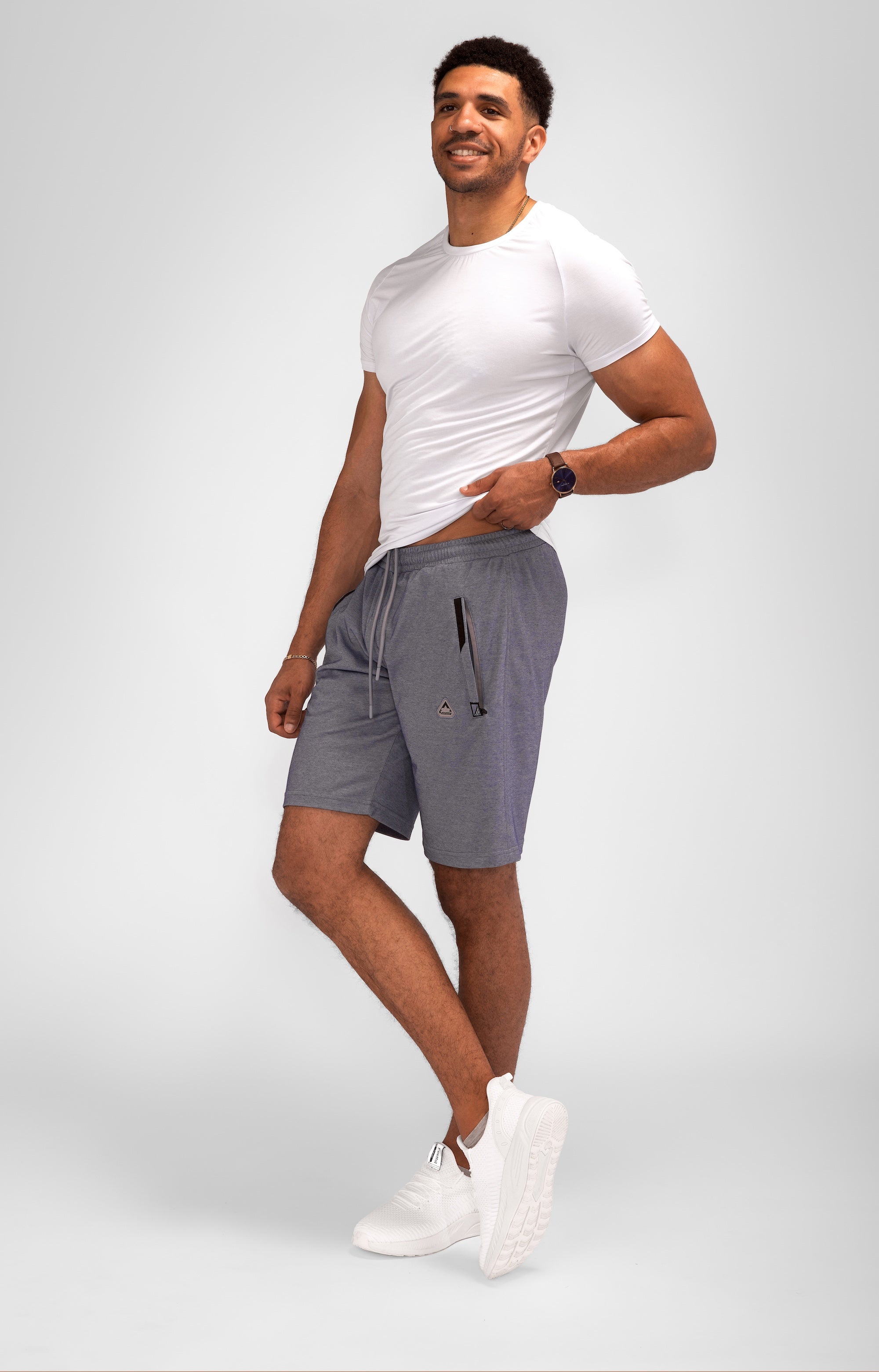 Gray SCR Sportswear Urban Stride All-Day Wear Shorts with 11-inch inseam and zippered pockets, suitable for travel and casual wear.