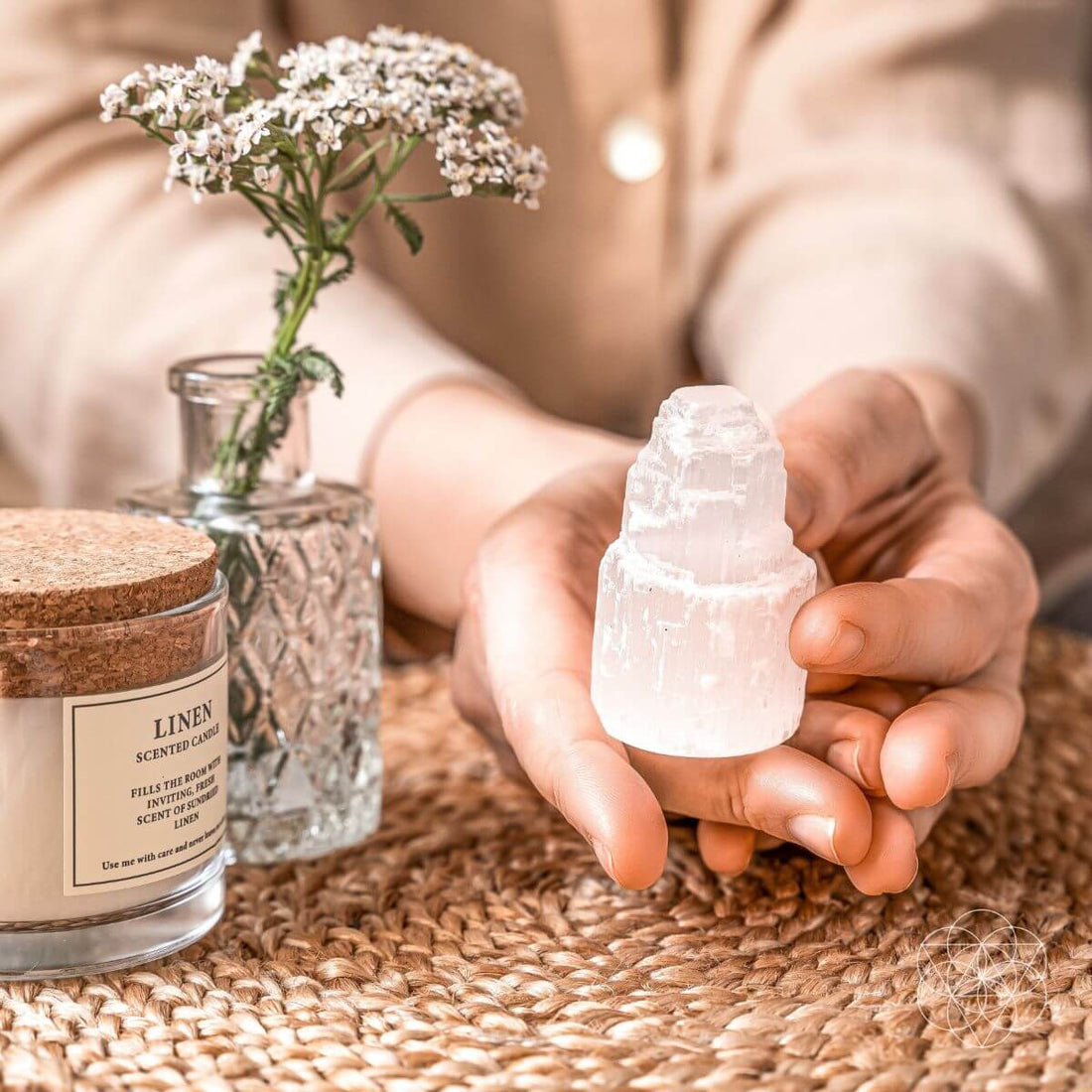 Selenite cleansing night light from Conscious Items with a glowing selenite lamp on a wooden surface.