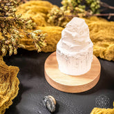 Selenite cleansing lamp night light by Conscious Items with a smooth, polished selenite crystal base emitting soft light