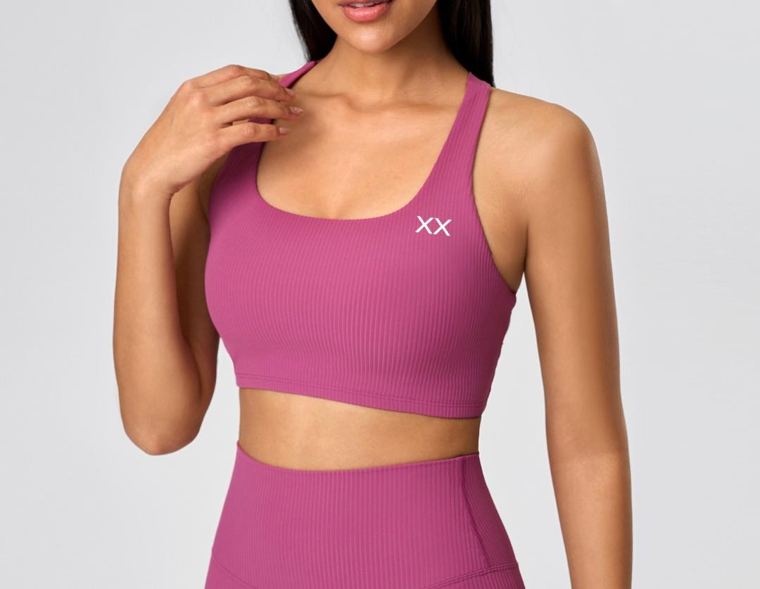 Black BLACKOUT BARBELL Vera bra featuring smooth fabric and adjustable straps, designed for comfort and support.