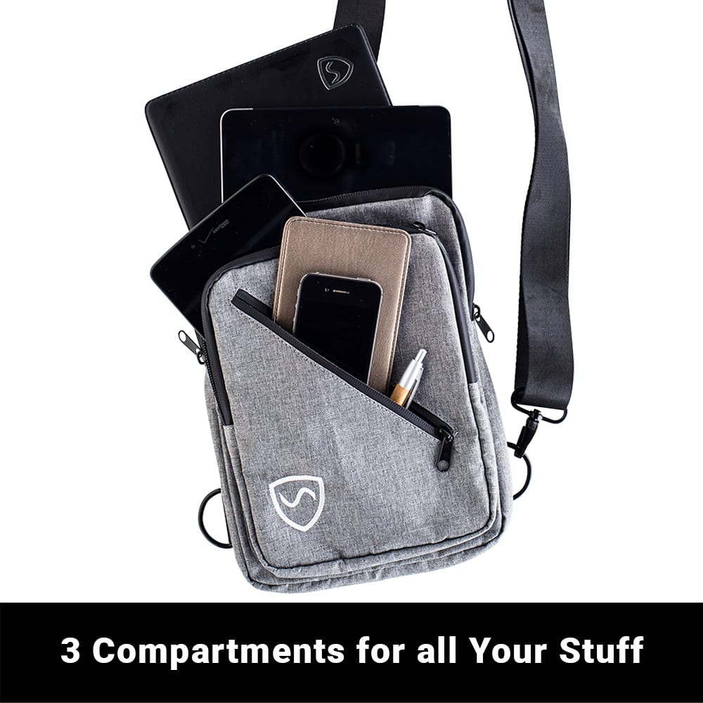 Shield Your Body SYB Sling Bag backpack with interior compartments and adjustable straps, shown with contents inside.
