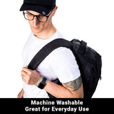 Shield Your Body wristband in black, shown on a person&