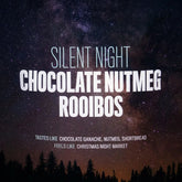 Cup of August Uncommon Tea Silent Night herbal rooibos tea with chocolate and nutmeg, showcasing a warm, cozy beverage.