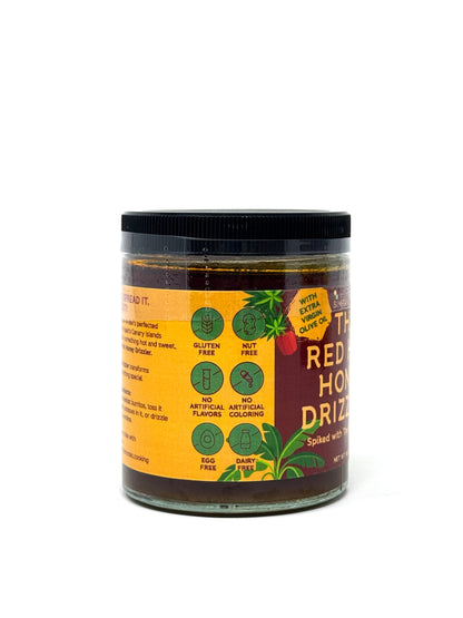 Bottle of Simrancooks Red Hot Honey Drizzler with spicy, sweet hot honey and a drizzle nozzle for adding flavor to dishes.
