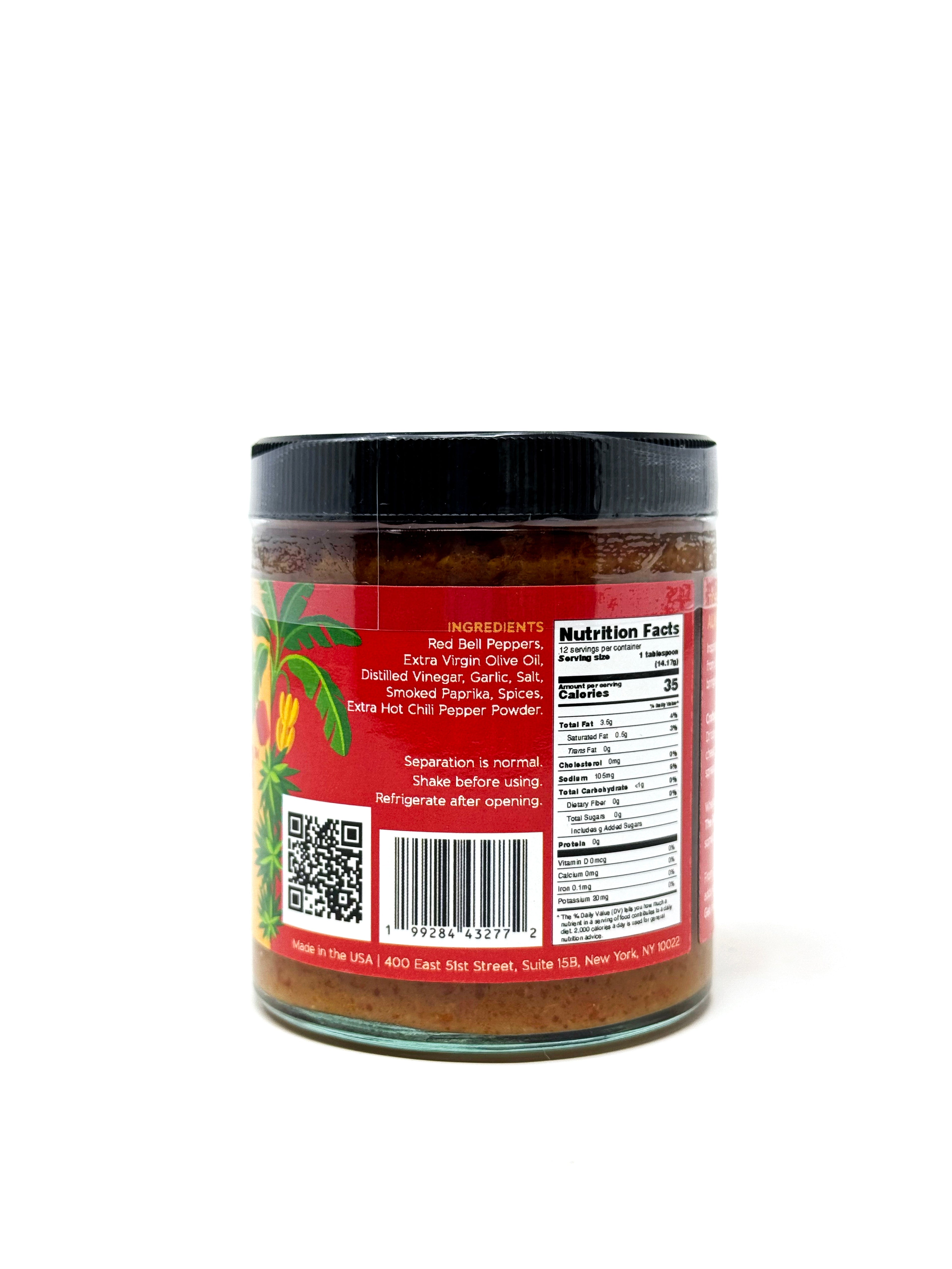Red Mojo Rojo drizzle from Simrancooks, featuring mild, vibrant ingredients in a glass jar, perfect for Spanish cuisine.